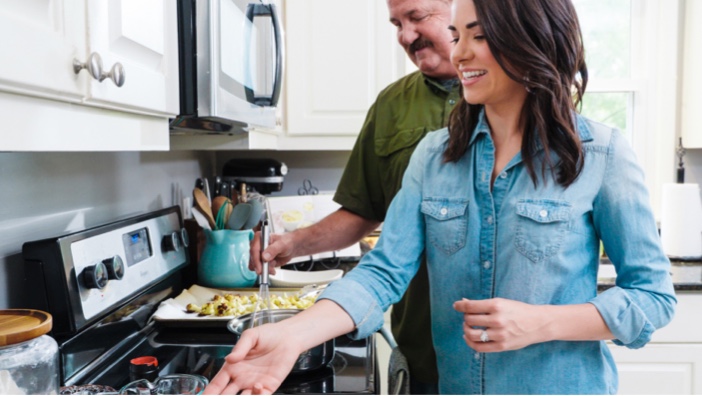 Image of John and Whitney cooking together